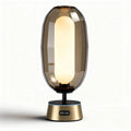 Glazen tafel lamp in oranje met een metalen voet 25 x 25 x 40cm